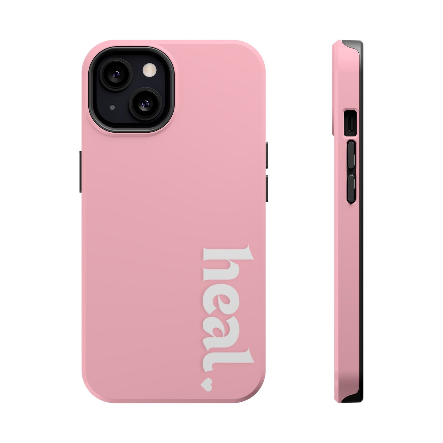 A pink iPhone case with the word 'heal' written on it, displayed on a table with candles and flowers in the background.