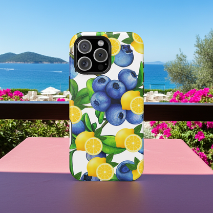 iPhone case with blueberries and lemons design on a table with a scenic background